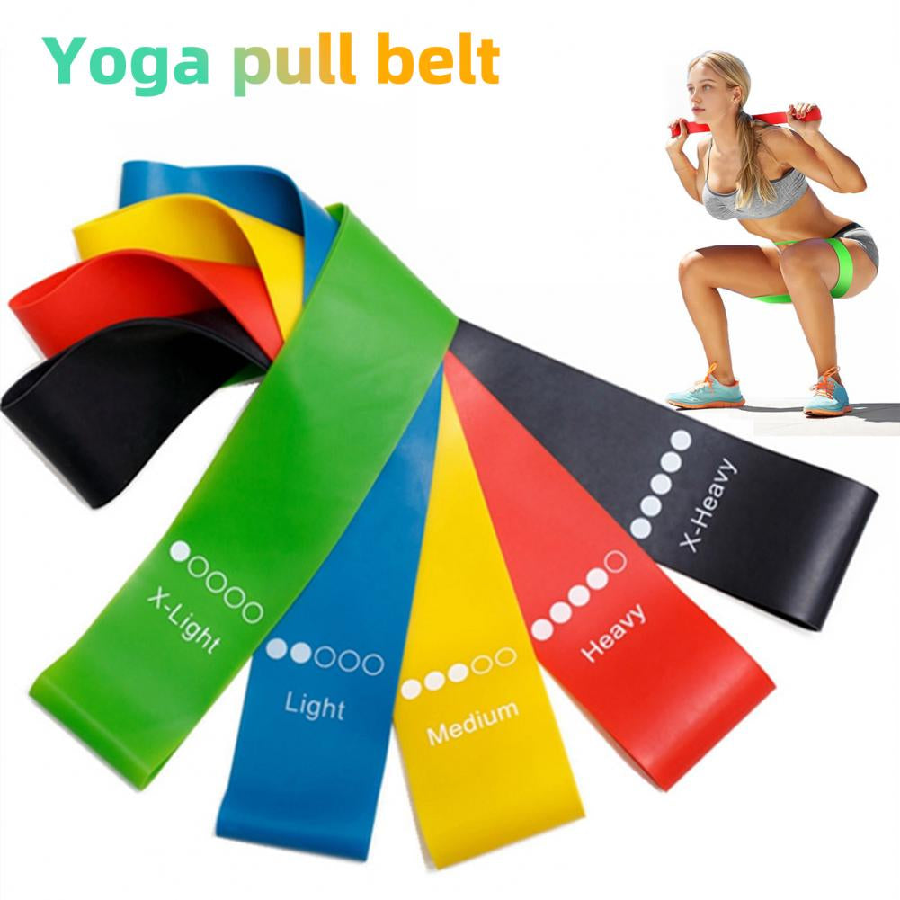 Woman doing squats with resistance band – yoga and pilates fitness training